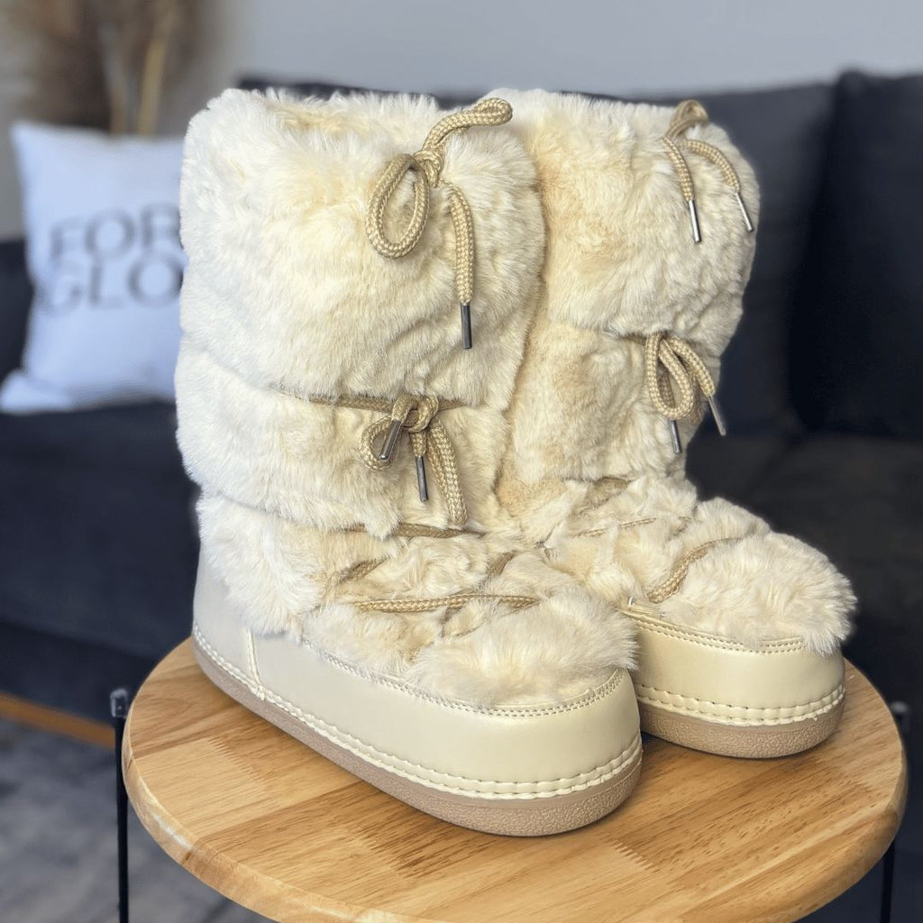 Women's fur lined snow boots worn outdoors