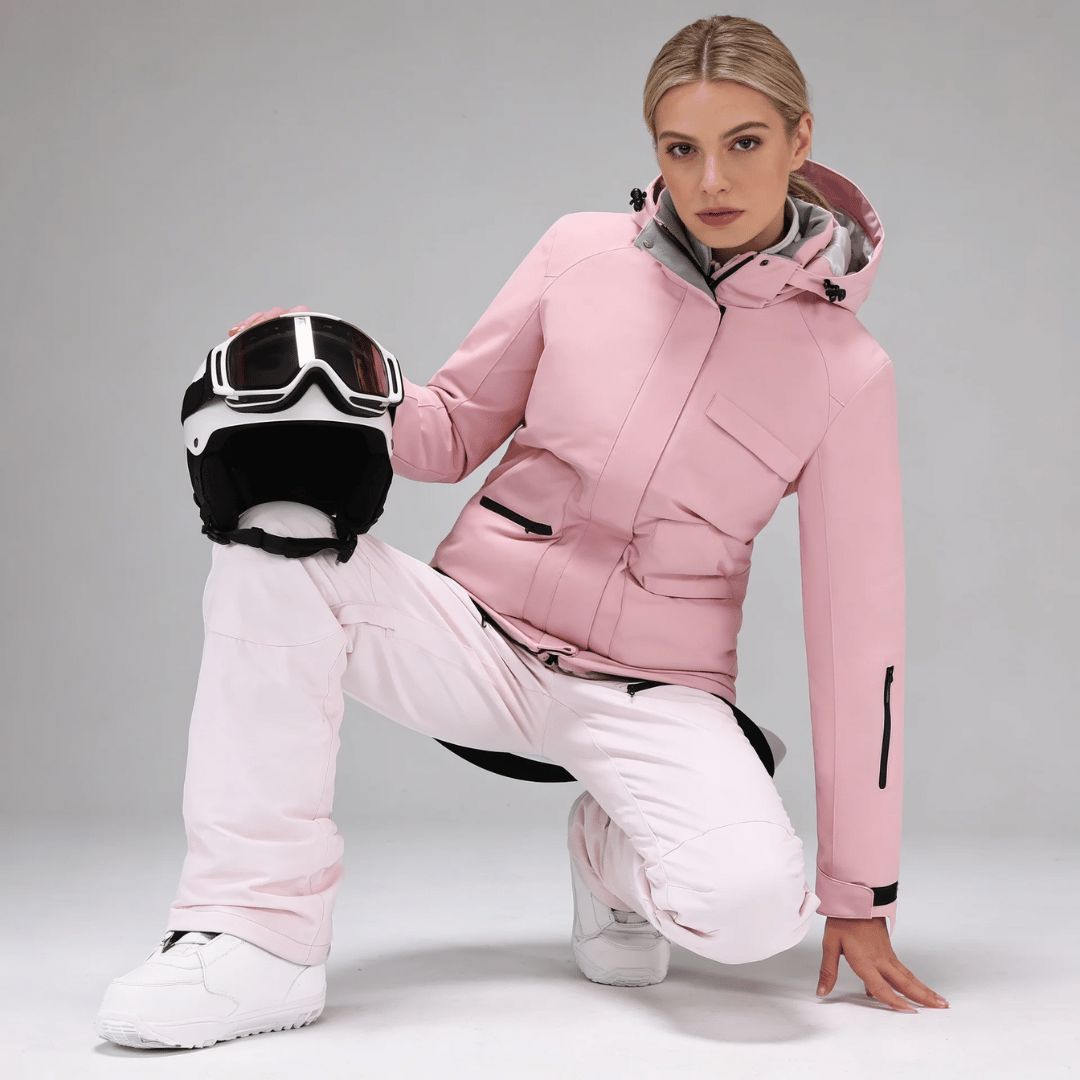 Women's ski jacket and braced salopettes worn on the snow