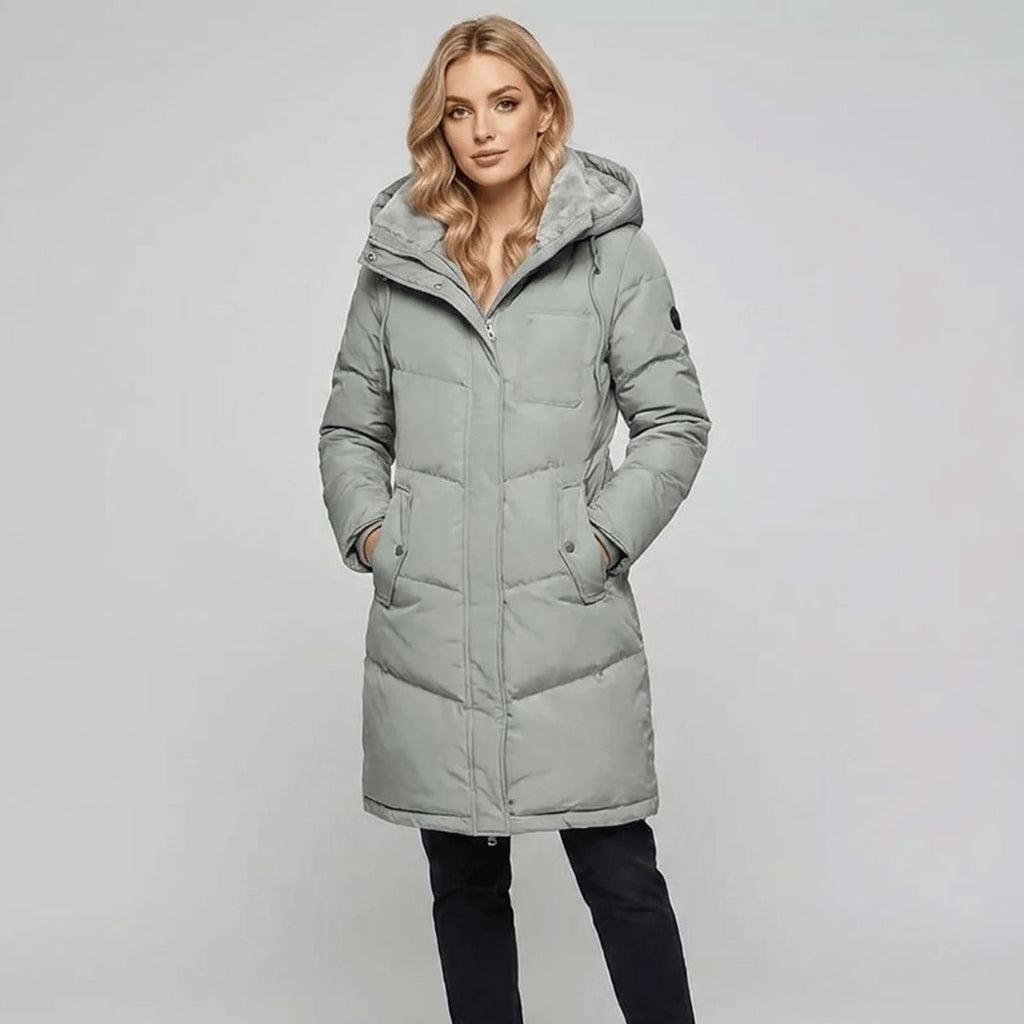 Women's padded parka in pastel green, worn outdoors