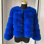 Women's faux fur coat worn open over a winter outfit