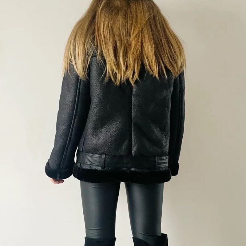 Women's faux leather jacket in black, worn in town